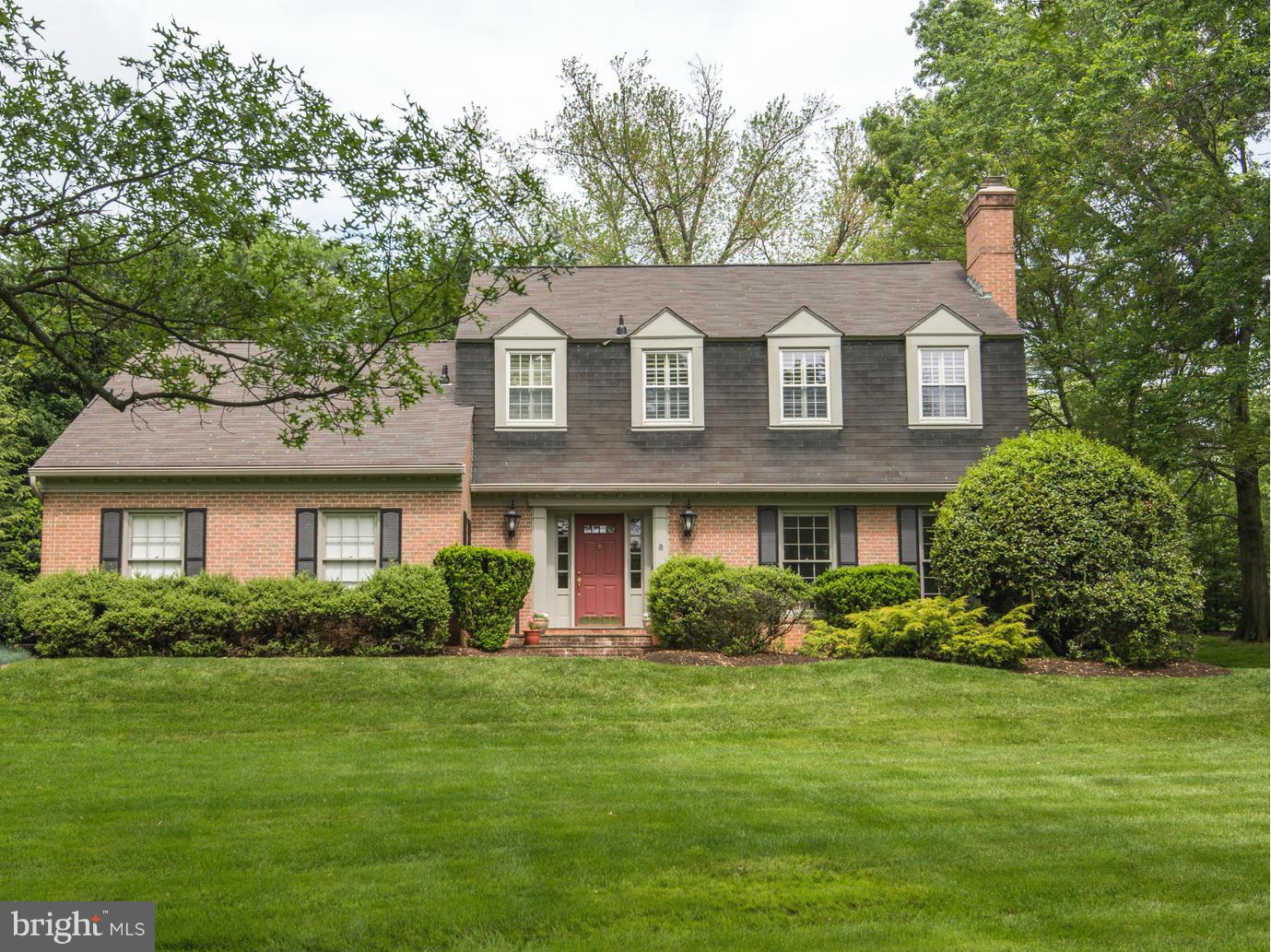 912 Kimberwicke Road McLean, VA 22102 - Photo 1 of 30 a front view of a house with a garden