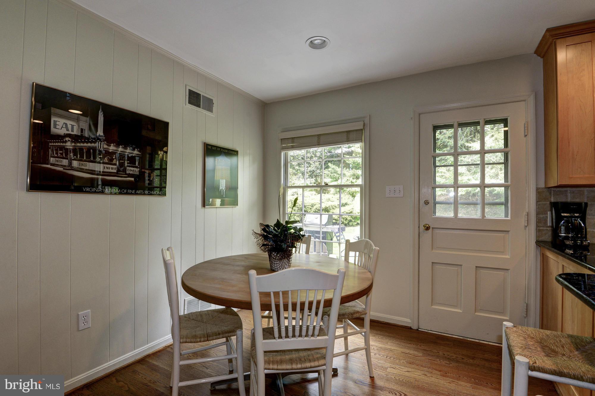 912 Kimberwicke Road McLean, VA 22102 - Photo 12 of 30 a view of a dining room with furniture window and wooden floor