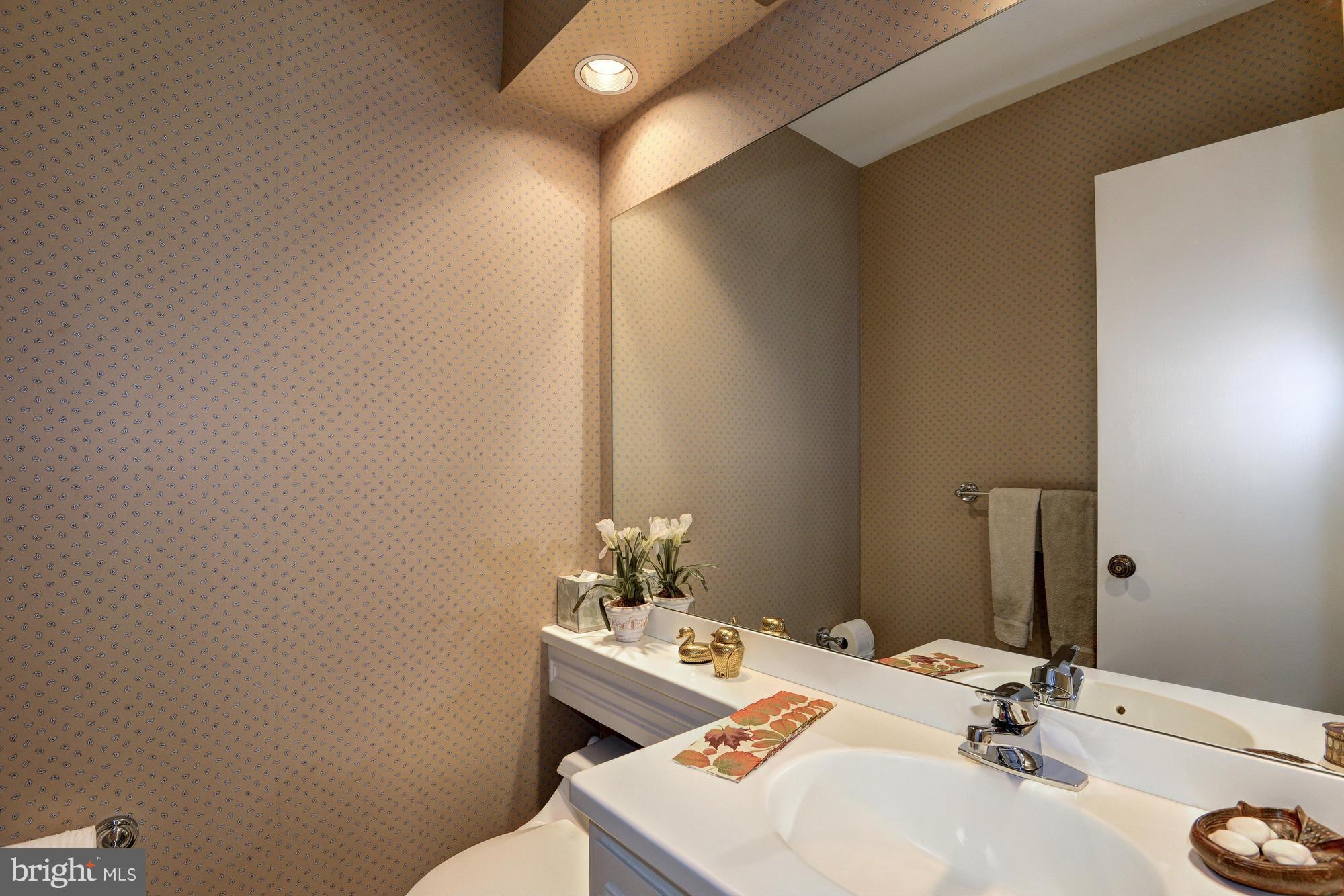 912 Kimberwicke Road McLean, VA 22102 - Photo 13 of 30 a bathroom with a sink and a mirror