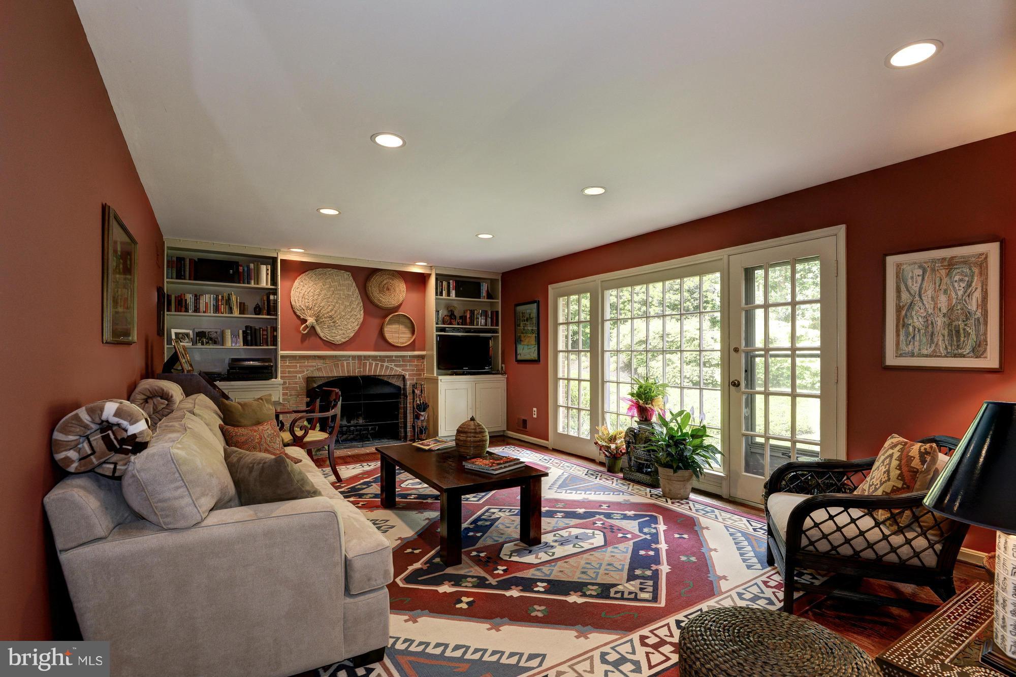 912 Kimberwicke Road McLean, VA 22102 - Photo 14 of 30 a living room with furniture fireplace and a large window