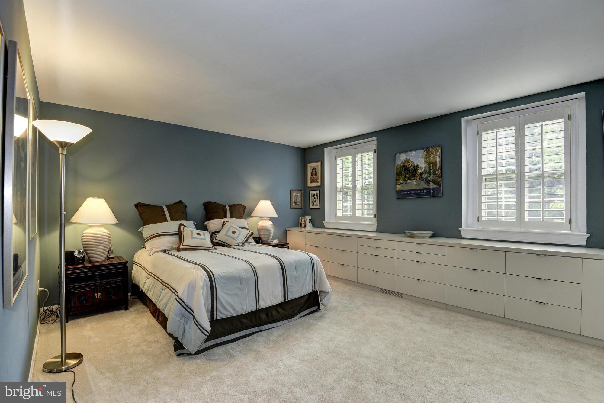 912 Kimberwicke Road McLean, VA 22102 - Photo 17 of 30 a spacious bedroom with a bed and a window
