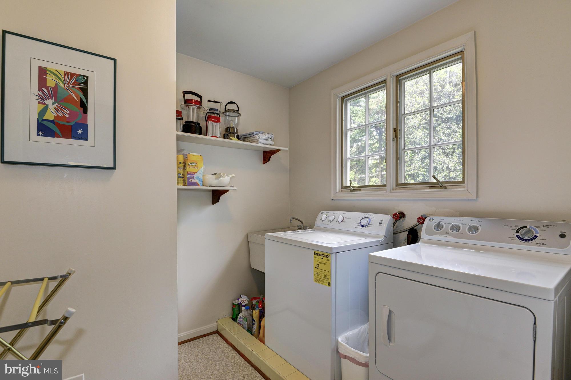 912 Kimberwicke Road McLean, VA 22102 - Photo 24 of 30 a utility room with dryer and washer
