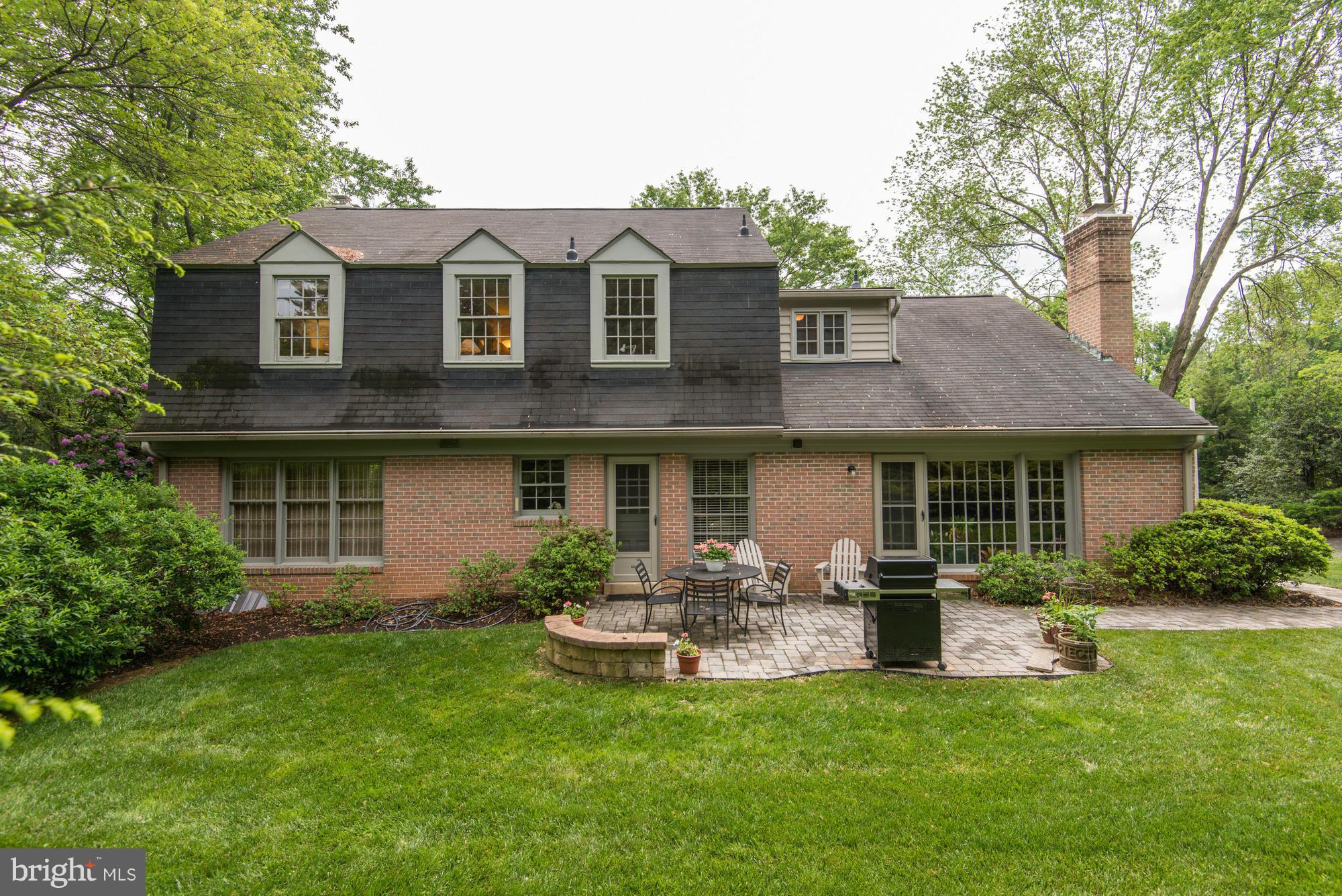 912 Kimberwicke Road McLean, VA 22102 - Photo 27 of 30 a front view of a house with a garden and plants