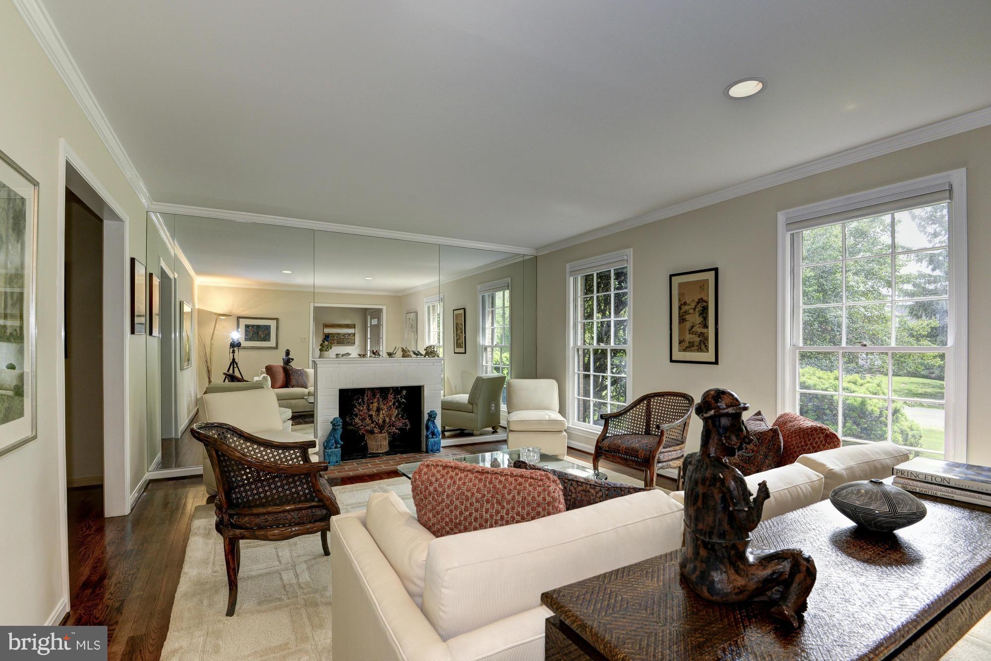 912 Kimberwicke Road McLean, VA 22102 - Photo 4 of 30 a living room with furniture fireplace and a large window