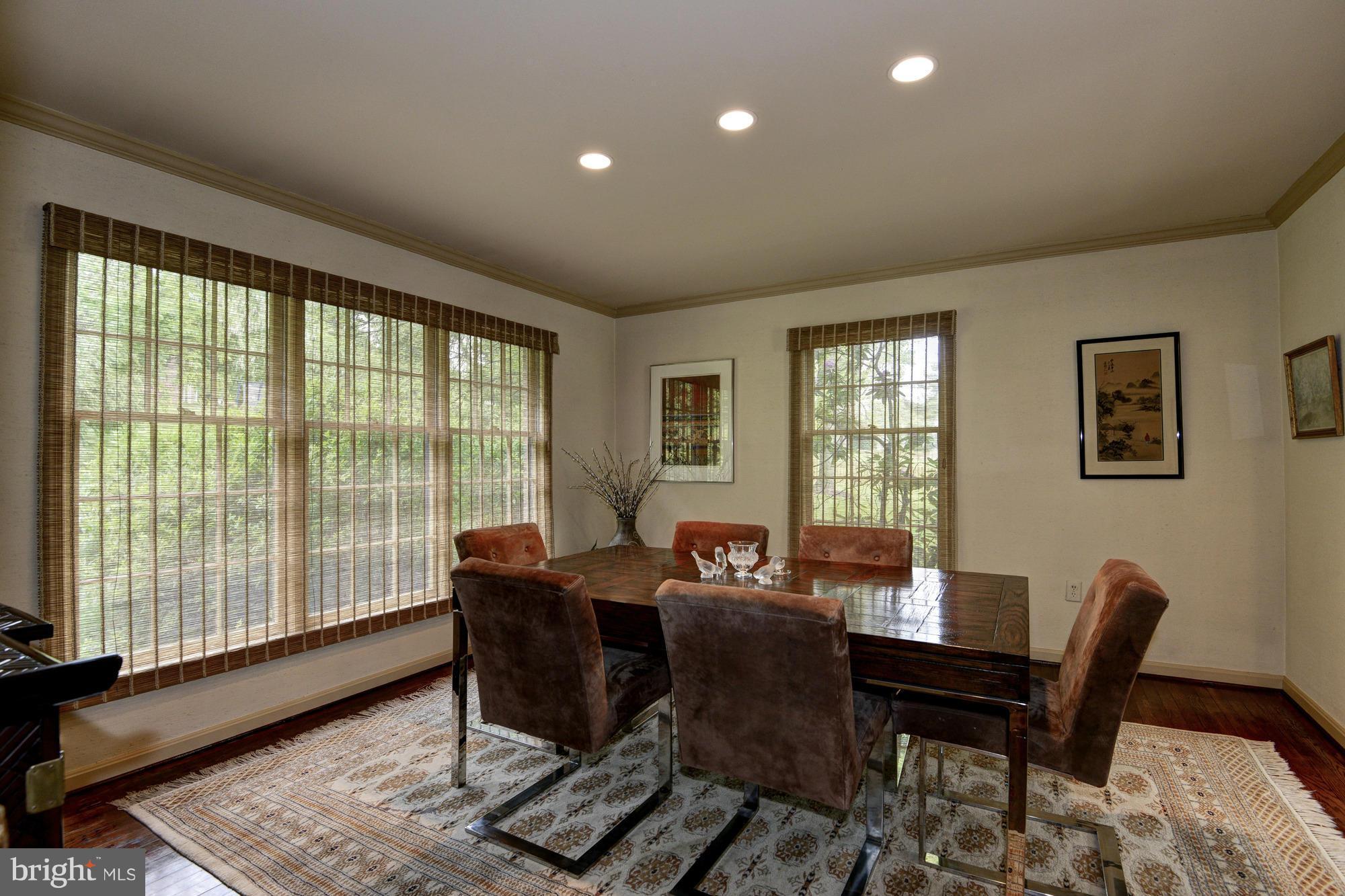 912 Kimberwicke Road McLean, VA 22102 - Photo 7 of 30 a view of a dining room with furniture window and wooden floor