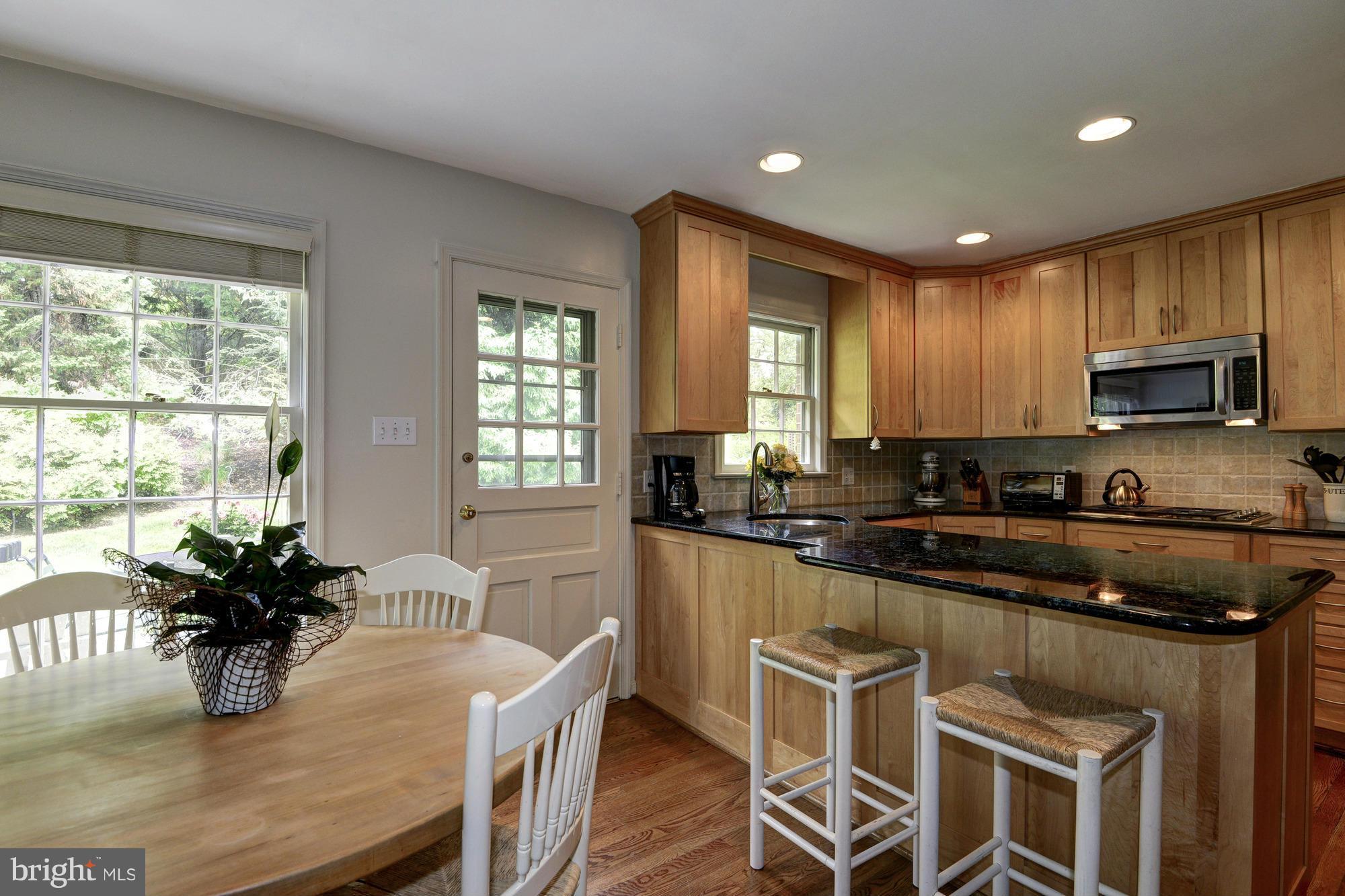 912 Kimberwicke Road McLean, VA 22102 - Photo 10 of 30 a kitchen with granite countertop lots of counter top space and stainless steel appliances