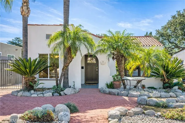 a couple of potted plants in front of door