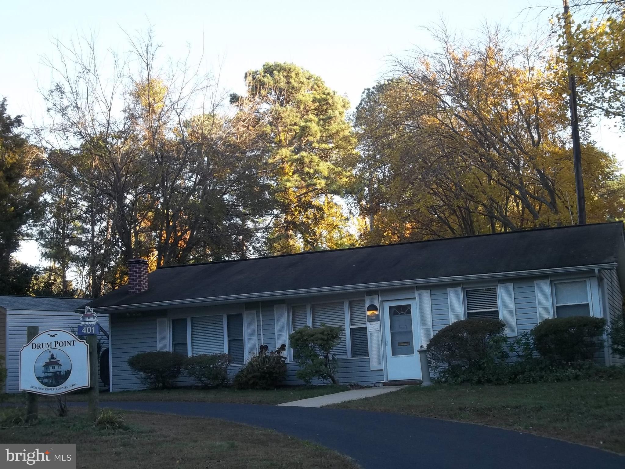 12924 Rousby Hall Road Lusby, MD 20657 - Photo 15 of 15 a front view of a house with garden