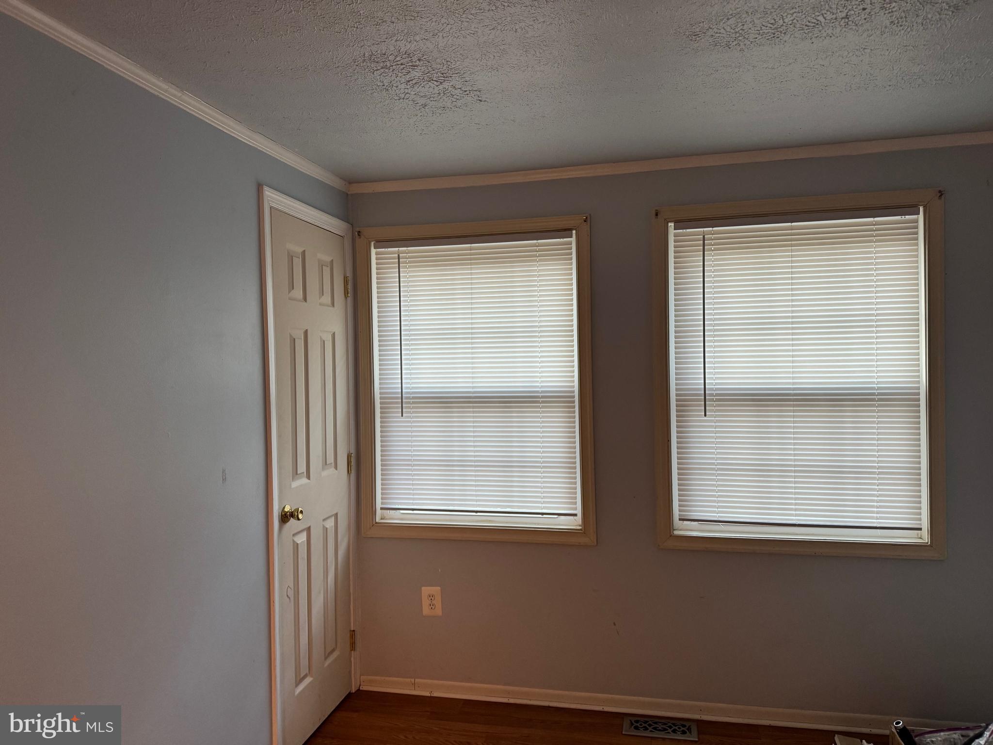 12924 Rousby Hall Road Lusby, MD 20657 - Photo 9 of 15 a view of an empty room with a window
