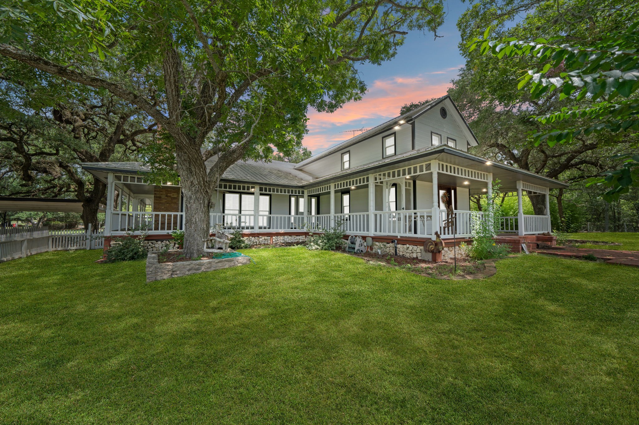 This stunning 24-acre property just minutes from La Grange has it all — rolling hills, majestic century-old live oaks, a beautifully updated home with a pool, multiple barns, and incredible commercial potential with prime frontage on Highway 159