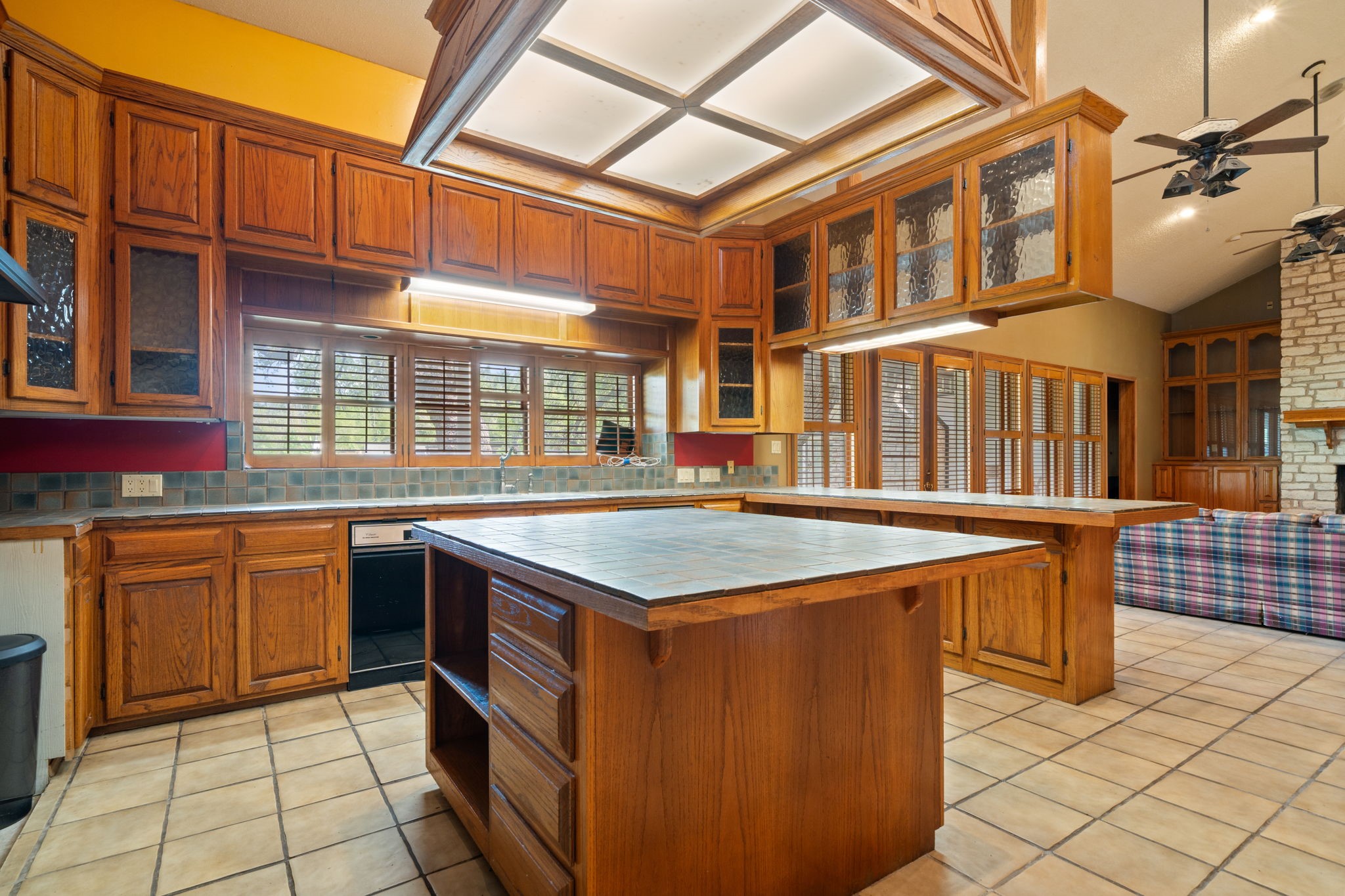 3541 Highway 159 La Grange, TX 78945 - Photo 12 of 38 Wonderful kitchen with plenty of counterspace, an island, wooden cabinetry, and a breathtaking skylight!