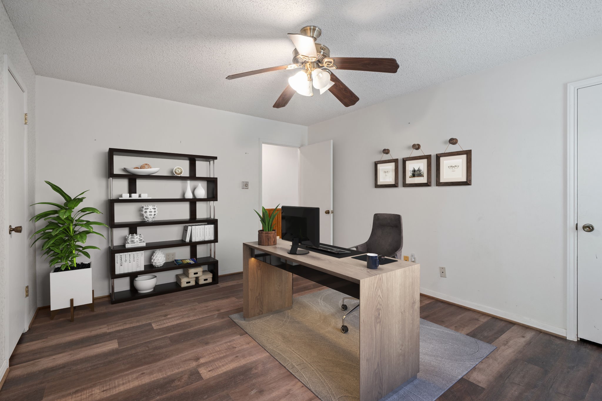 3541 Highway 159 La Grange, TX 78945 - Photo 23 of 38 Virtually Staged: This room is perfect for a home office. Featuring dark stained wood floors, and a ceiling fan.