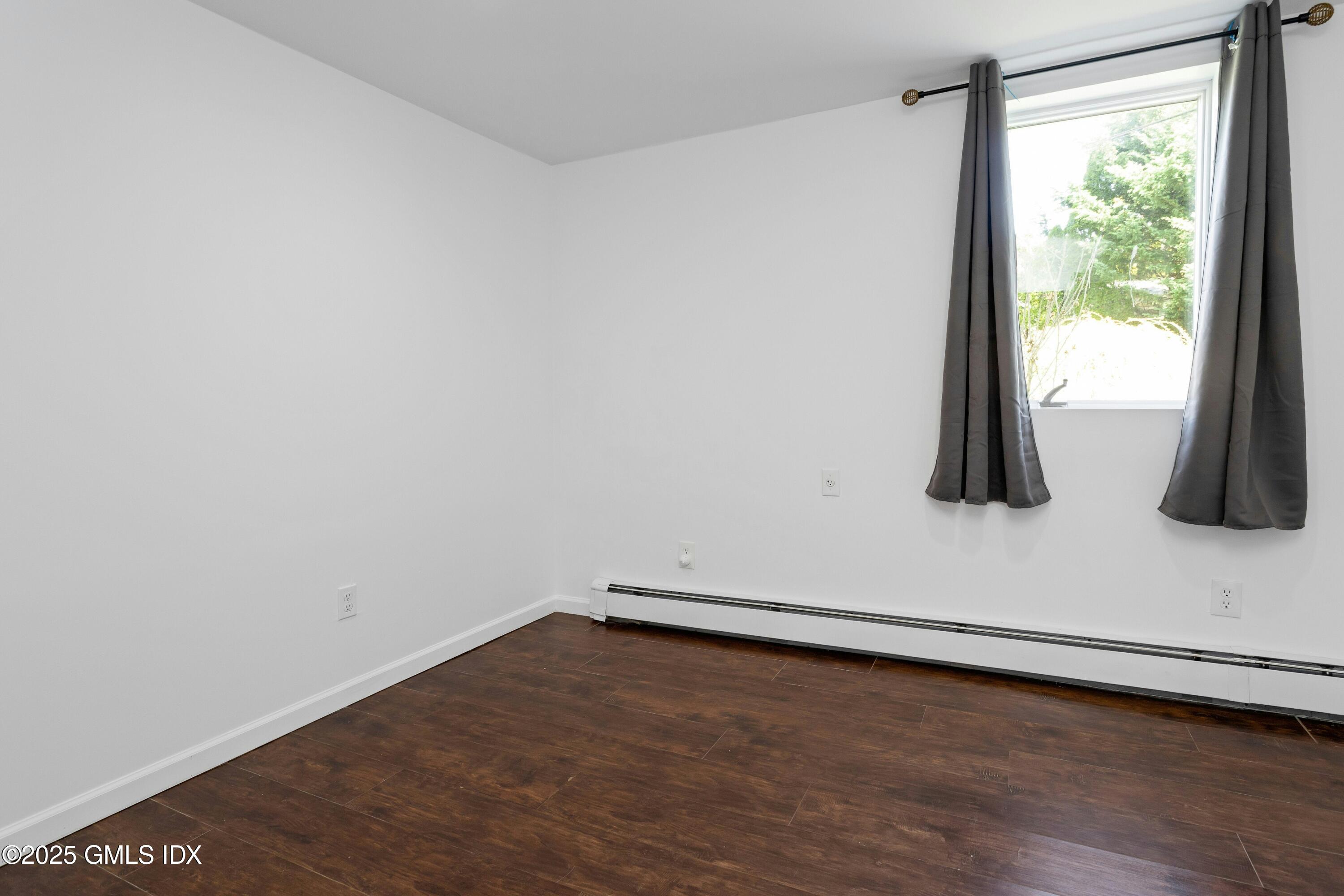 171 1/2 Henry Street, Unit A Greenwich, CT 06830 - Photo 14 of 25 a view of a room with wooden floor and sink