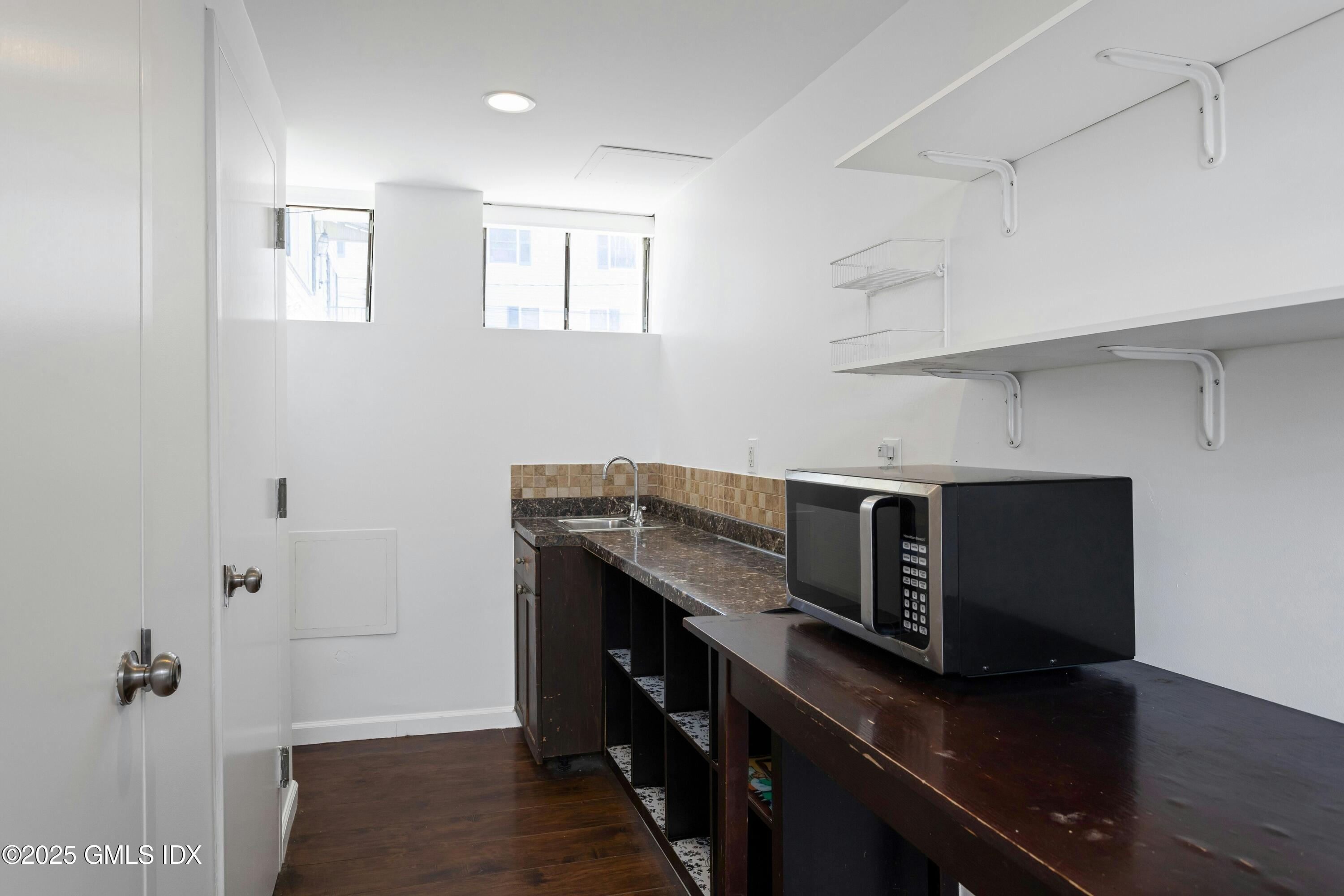 171 1/2 Henry Street, Unit A Greenwich, CT 06830 - Photo 20 of 25 a view of a kitchen with electric appliances