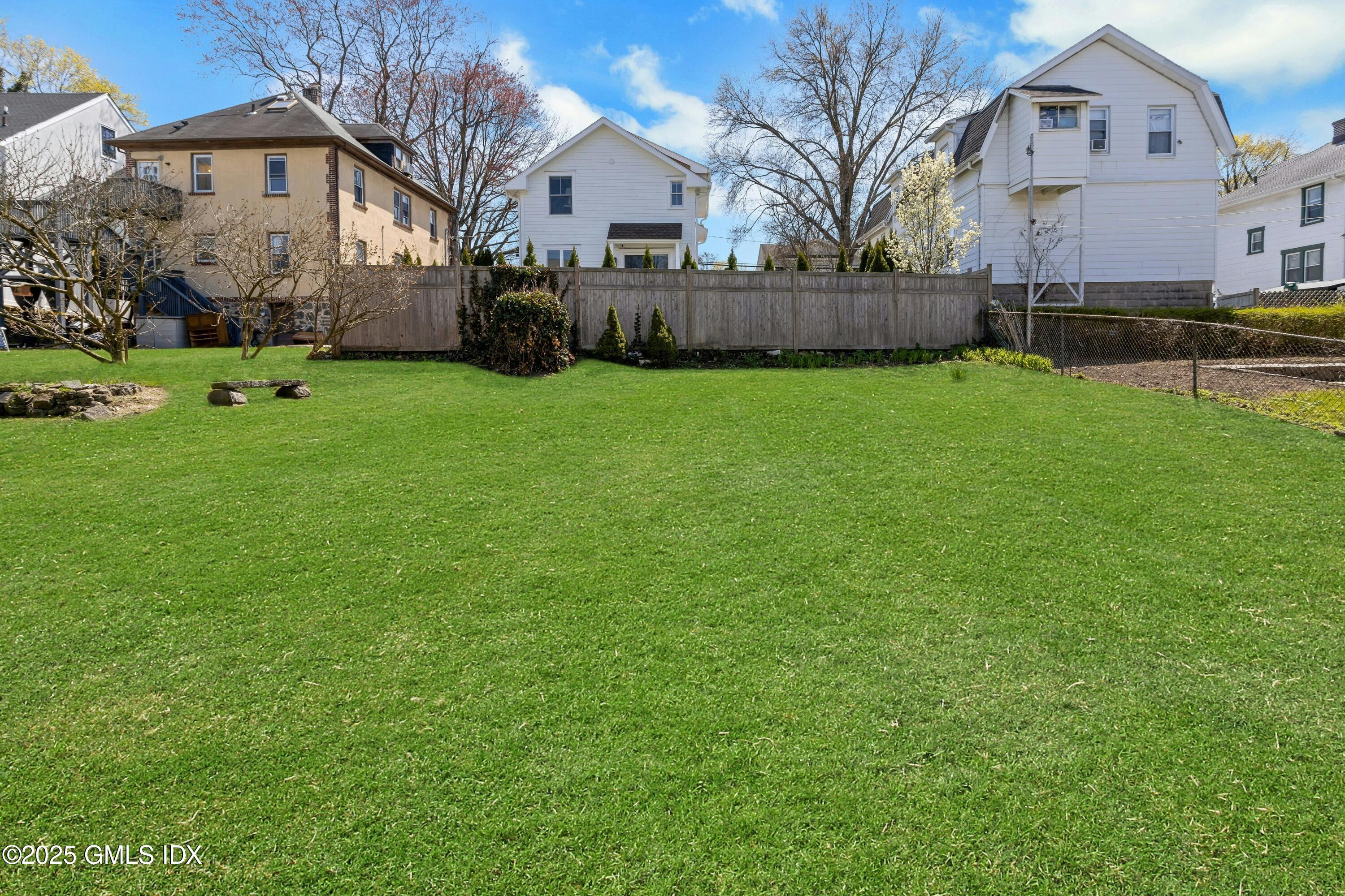 171 1/2 Henry Street, Unit A Greenwich, CT 06830 - Photo 21 of 25 a view of house with a yard