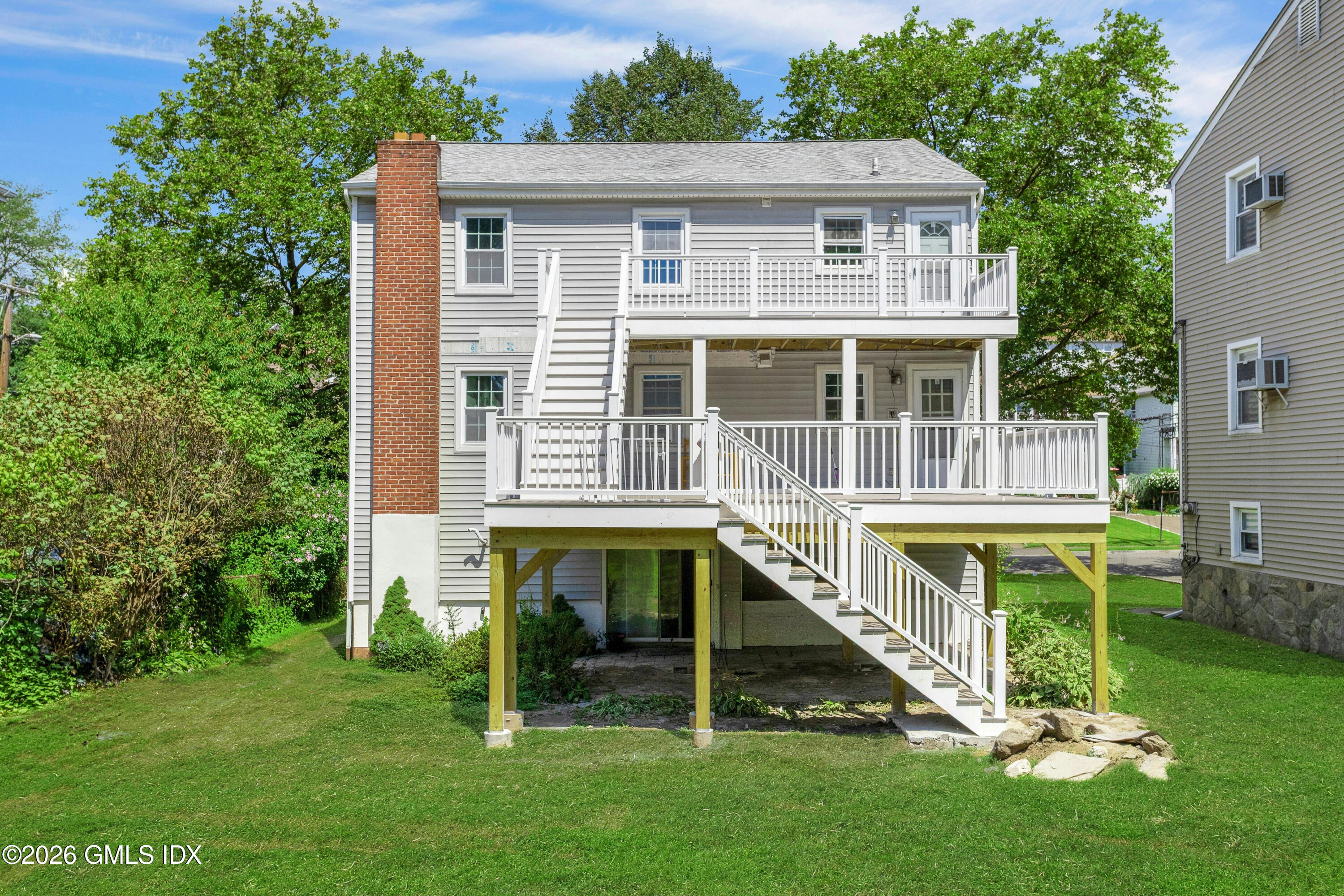 171 1/2 Henry Street, Unit A Greenwich, CT 06830 - Photo 25 of 25 a view of house with a big yard and potted plants