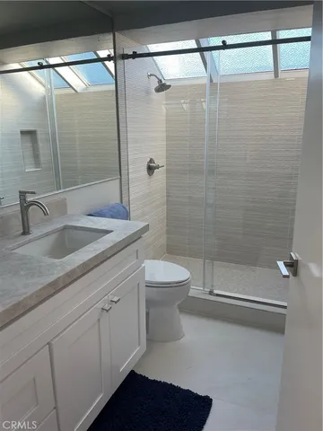 a kitchen with a sink and refrigerator