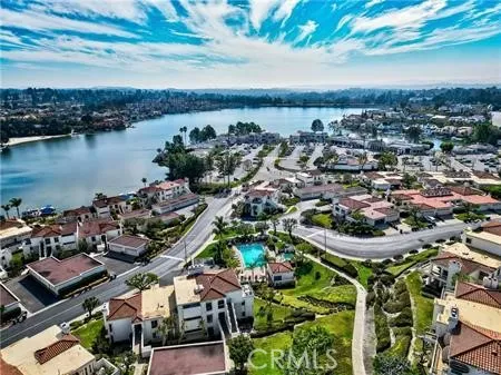 an aerial view of a house with a lake view