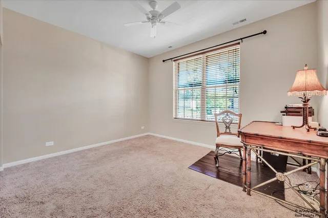 a workspace with furniture and a window