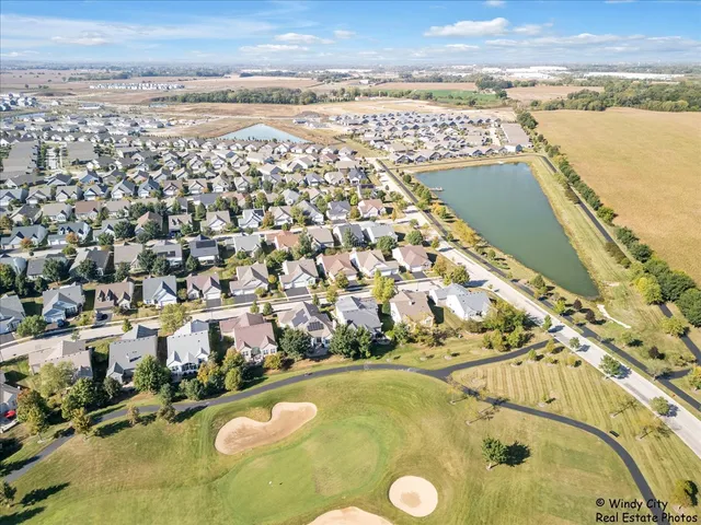 an aerial view of a residential building with outdoor space