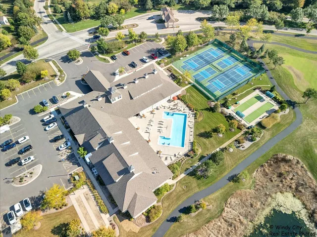 an aerial view of a house with a ocean view