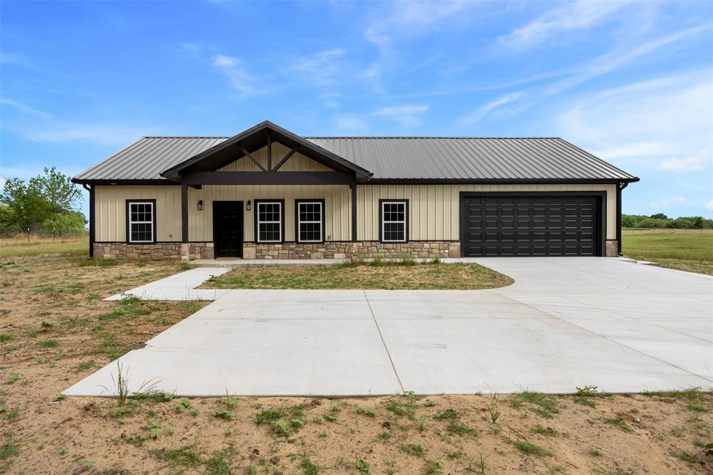 121 Brazier Road Ennis, TX 75119 - Photo 3 of 31 a front view of a house with yard