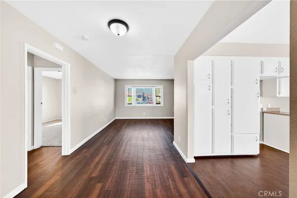 a spacious bathroom with a granite countertop sink and a mirror