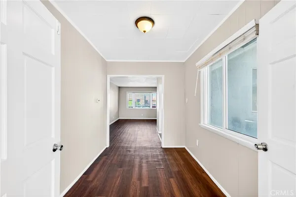a view of an empty room with glass door