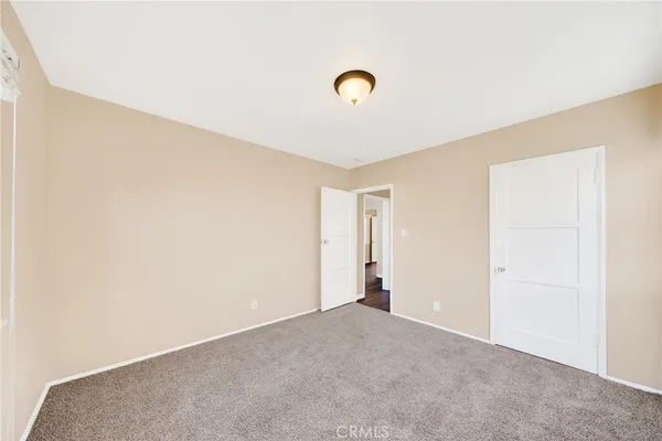 a bathroom with a bathtub shower sink vanity and mirror