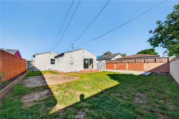 a balcony view with a backyard space