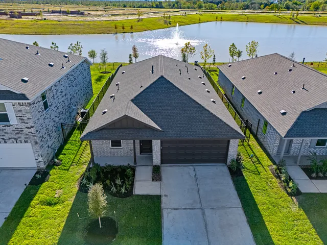 a aerial view of a house with a swimming pool