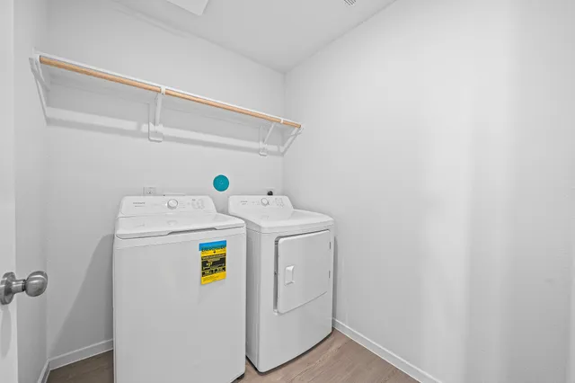 a view of a kitchen with wooden floor