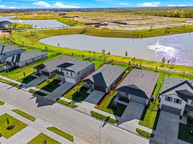 an aerial view of a house with a swimming pool