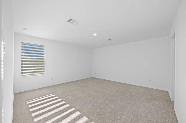 a bathroom with a toilet shower and vanity