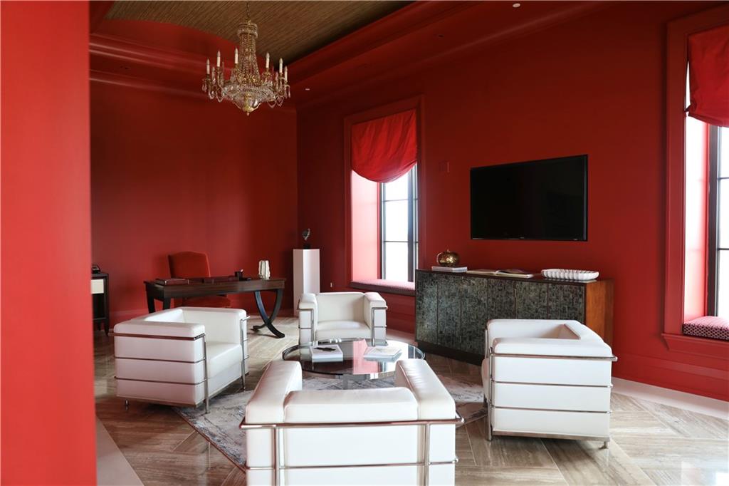 88 West Paces Ferry Road Northwest, Unit 1130 Atlanta, GA 30305 - Photo 13 of 43 a living room with furniture and a flat screen tv