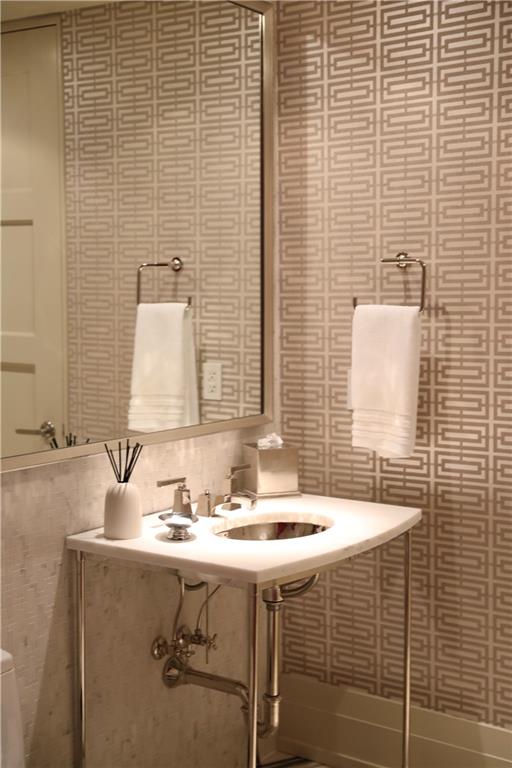 88 West Paces Ferry Road Northwest, Unit 1130 Atlanta, GA 30305 - Photo 21 of 43 a bathroom with a sink and a mirror