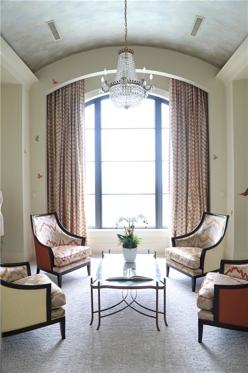 88 West Paces Ferry Road Northwest, Unit 1130 Atlanta, GA 30305 - Photo 25 of 43 a living room with furniture and a chandelier