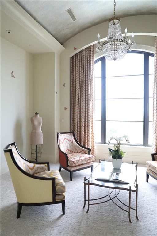 88 West Paces Ferry Road Northwest, Unit 1130 Atlanta, GA 30305 - Photo 26 of 43 a living room with furniture and a chandelier