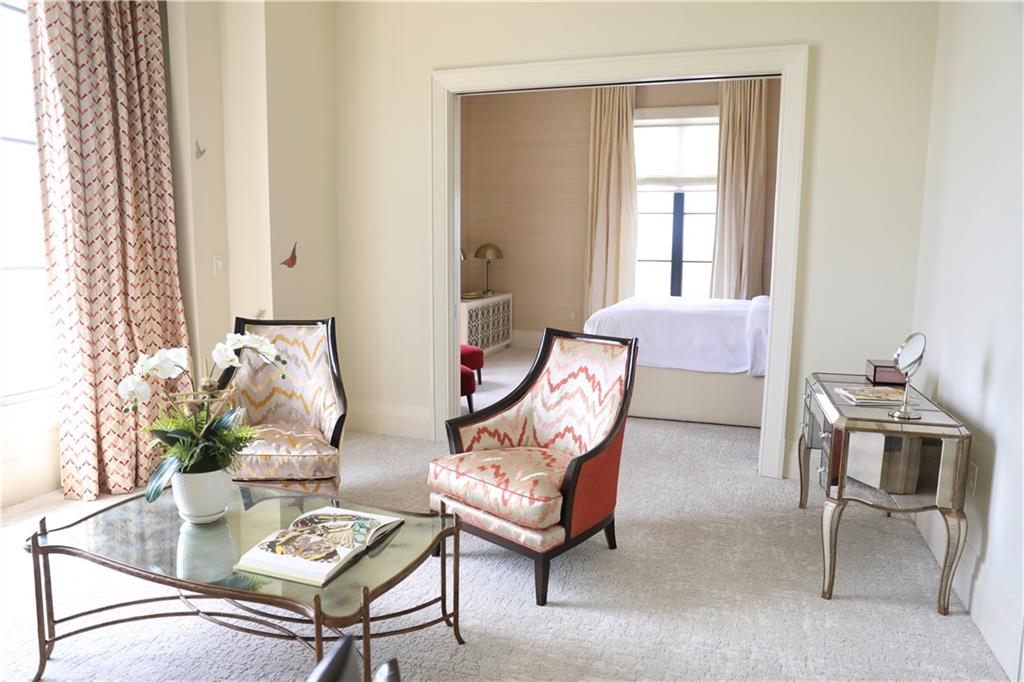 88 West Paces Ferry Road Northwest, Unit 1130 Atlanta, GA 30305 - Photo 27 of 43 a living room with furniture a rug and a window