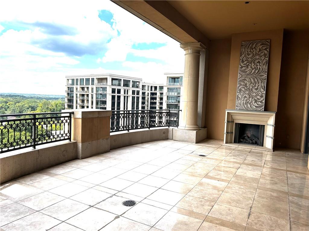 88 West Paces Ferry Road Northwest, Unit 1130 Atlanta, GA 30305 - Photo 34 of 43 a view of an empty room with a fireplace