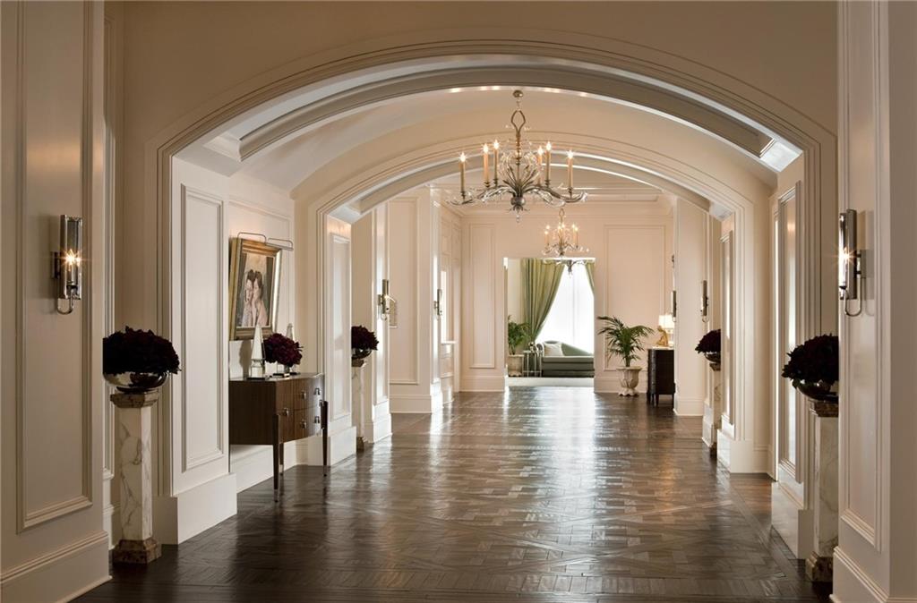 88 West Paces Ferry Road Northwest, Unit 1130 Atlanta, GA 30305 - Photo 39 of 43 a view of a hallway with wooden floor fireplace and living room