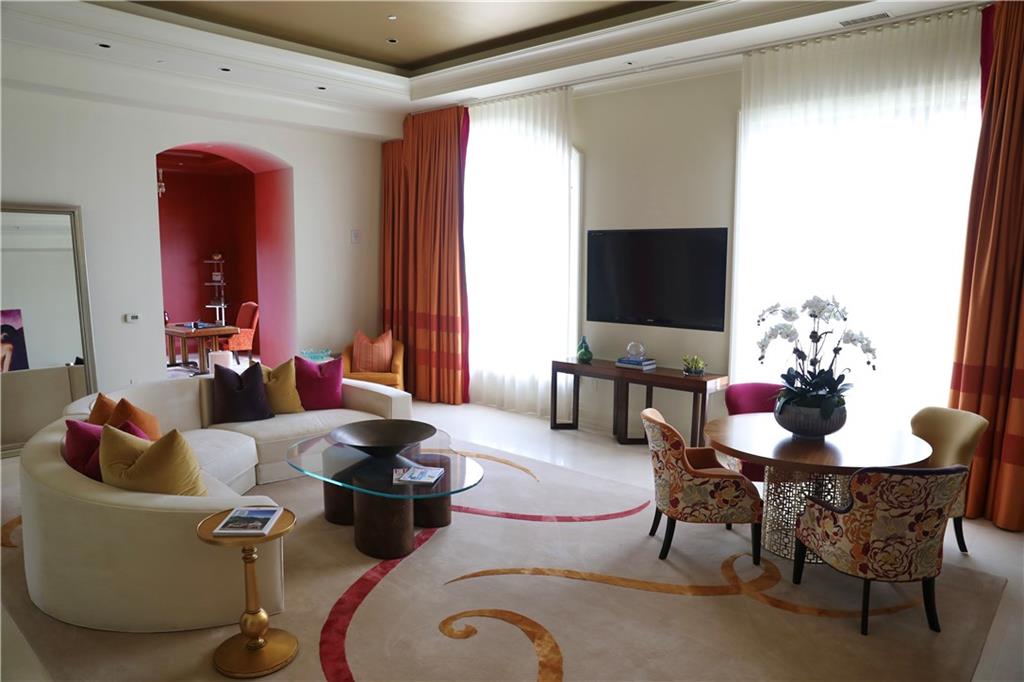 88 West Paces Ferry Road Northwest, Unit 1130 Atlanta, GA 30305 - Photo 7 of 43 a living room with furniture and a flat screen tv