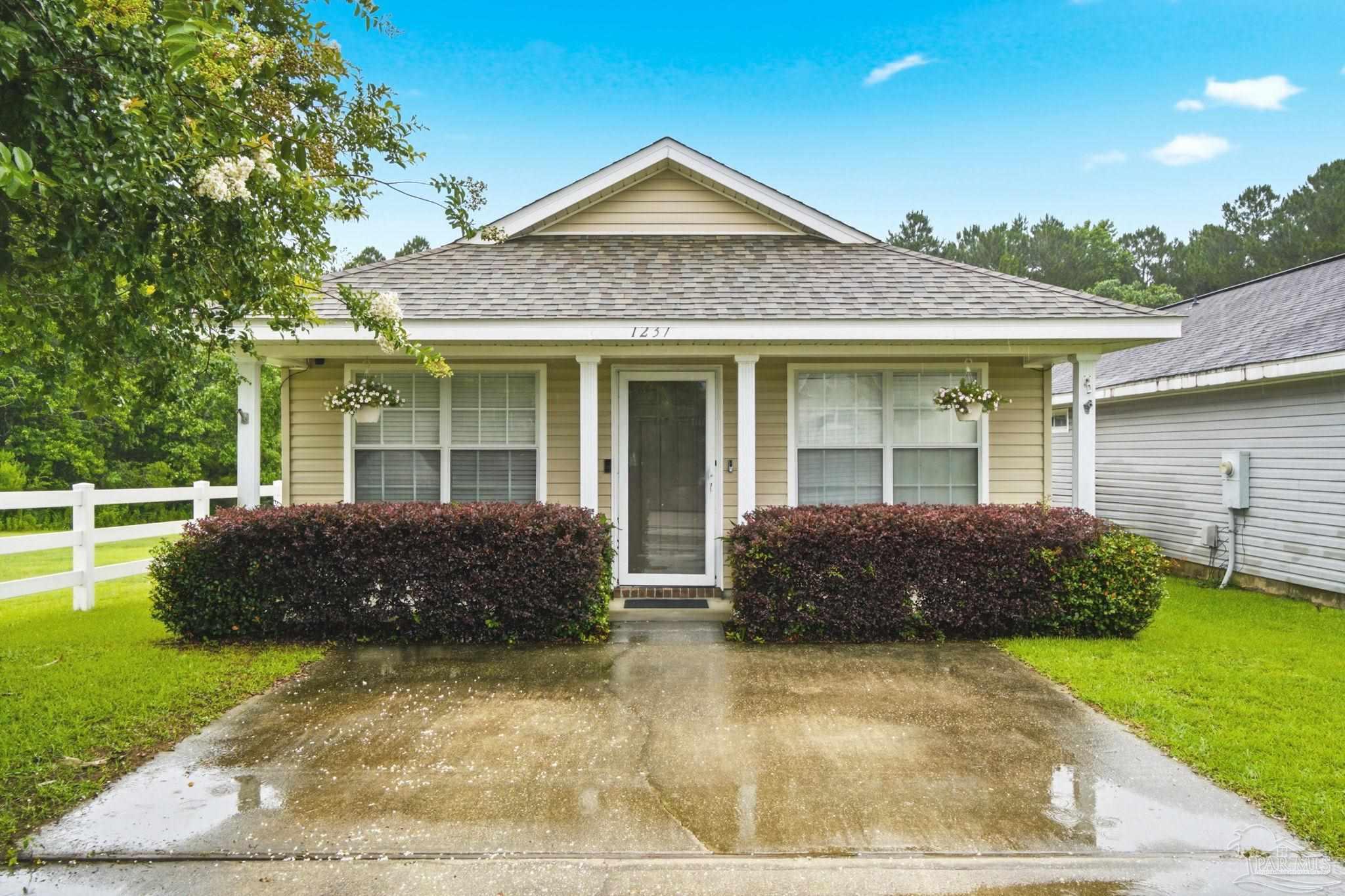1237 Brownfield Road Pensacola, FL 32526 - Photo 2 of 30 a front view of a house with garden