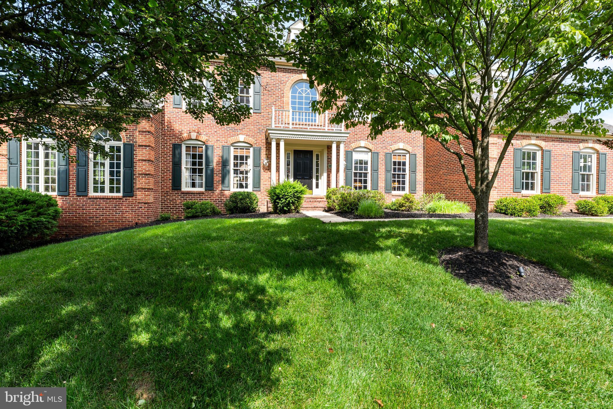 7 Redtree Lane Reisterstown, MD 21136 - Photo 3 of 56 a front view of a house with a garden and trees