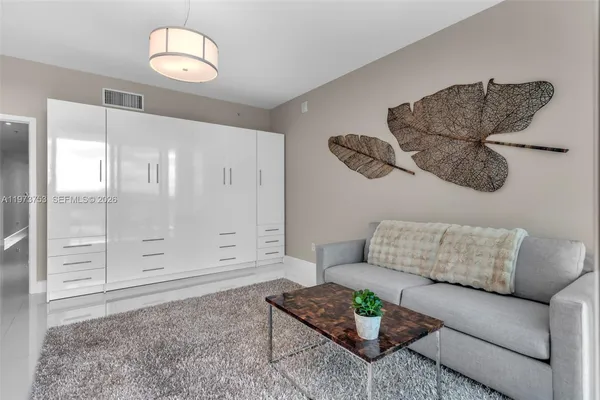 a bathroom with a sink toilet and a mirror