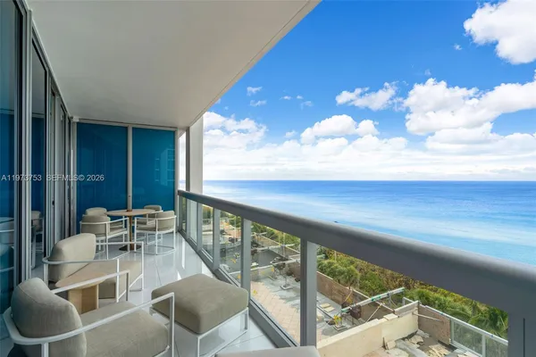 a view of balcony with furniture