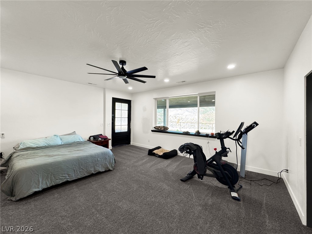 9393 North 93rd Highway Caliente, NV 89008 - Photo 20 of 41 A versatile room combines rest and recreation, with ample natural light from the expansive window.
