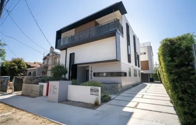 a view of a building with sitting area
