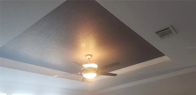 a bathroom with a granite countertop double vanity sink and a mirror