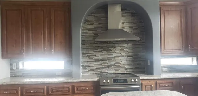 a view of a hallway with paintings on the wall